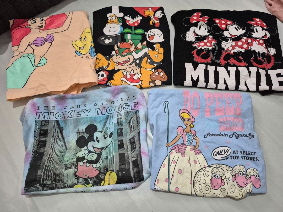 Official Disney & Mario Graphic Tees (Category: Shirts) located in Calamba. Submitted by bb.lace (Listing ID 1463988197, Image 1). Description: 380 aspack pm me for images of flaws di na kasya sa listing Mario L - slight undone stitch on neckline, good print no cracks Minnie XL - signs of usage only Mickey tie dye M - lints magkabilaan sa kilikili Ariel XL - no issue, no crack on print Bo peep S - signs of usage, may stain sa print.
