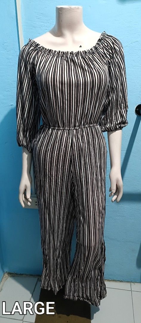 Off-Shoulder Jumpsuit (Category: Jumpsuits) located in Quezon City. Submitted by davidclothing (Listing ID 1464063561, Image 1). Description: - Stylish black and white striped jumpsuit - Flattering off-shoulder neckline with elastic - Elastic waistband for a cinched, comfortable fit - Relaxed wide leg pants - Perfect for casual outings - Size: Large.