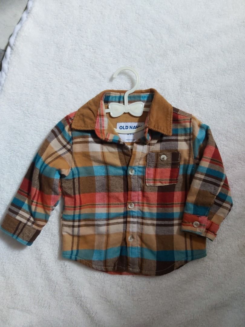 Old Navy Plaid Long Sleeve Shirt (Category: Babies & Kids Fashion) located in Manila. Submitted by sharmaine.24 (Listing ID 1464078525, Image 1). Description: - Cute plaid shirt from Old Navy - Features a corduroy collar - Button-up front - Long sleeves with button cuffs - Great for layering or wearing alone - Perfect for kids.