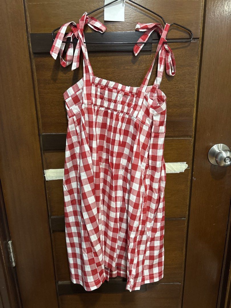 Old Navy Red Gingham Tie Strap Dress XS (Category: Dresses) located in Mandaluyong City. Submitted by clothescarousel (Listing ID 1464053956, Image 3). Description: - Cute red and white gingham dress - Brand: Old Navy - Features: Tie shoulder straps, smocked back - Skirt: Flattering A-line cut with pleats - Occasion: Great for picnics or casual outings - Size: XS.