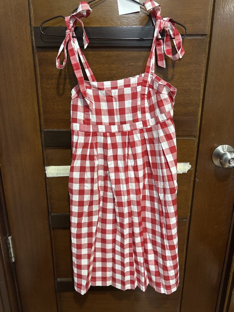 Old Navy Red Gingham Tie Strap Dress XS (Category: Dresses) located in Mandaluyong City. Submitted by clothescarousel (Listing ID 1464053956, Image 1). Description: - Cute red and white gingham dress - Brand: Old Navy - Features: Tie shoulder straps, smocked back - Skirt: Flattering A-line cut with pleats - Occasion: Great for picnics or casual outings - Size: XS.