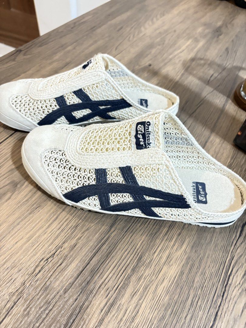 Onitsuka Tiger Mesh Slip-On Mules (Category: Slippers & Slides) located in Malabon City. Submitted by lordleadtheway26 (Listing ID 1464130150, Image 1). Description: Onitsuka Tiger slip-on mules. Cream/off-white mesh upper with navy blue tiger stripes. Easy to wear, great for casual outings. Soles show some signs of wear but still have plenty of grip. Check photos for details. 9800 orig price 🙂.