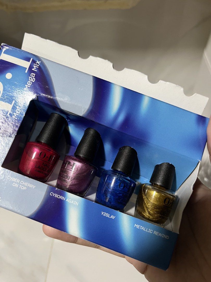 OPI Metallic Mega Mix Nail Lacquer Set (Category: Hands & Nails) located in Cavite. Submitted by nadzz28 (Listing ID 1464046515, Image 1). Description: - OPI Metallic Mega Mix Nail Lacquer Set - Includes 4 mini bottles (3.75ml each) - Shades: Cyber Cherry On Top, Cyborn Again, Y2Slay, Metallic Rewind - Ideal for experimenting with metallic nail finishes.