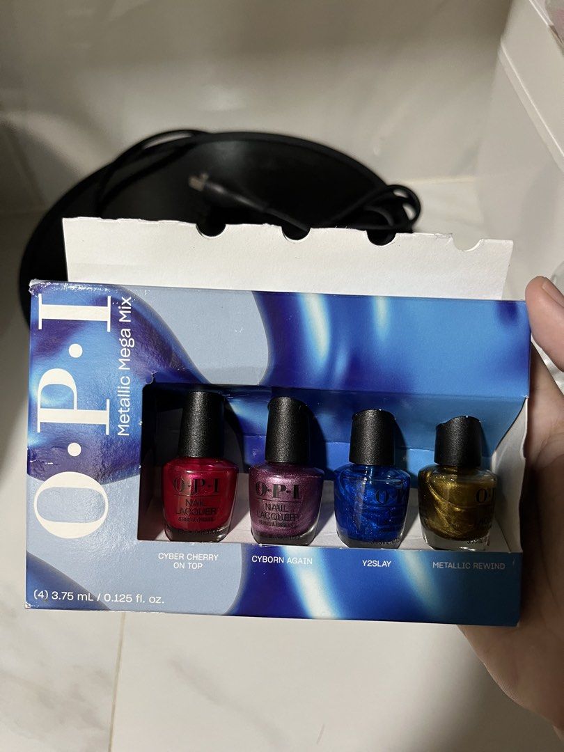 OPI Metallic Mega Mix Nail Lacquer Set (Category: Hands & Nails) located in Cavite. Submitted by nadzz28 (Listing ID 1464046515, Image 2). Description: - OPI Metallic Mega Mix Nail Lacquer Set - Includes 4 mini bottles (3.75ml each) - Shades: Cyber Cherry On Top, Cyborn Again, Y2Slay, Metallic Rewind - Ideal for experimenting with metallic nail finishes.