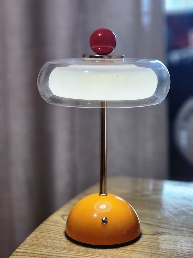 Orange and Clear Wall Lamp with Red Accent (Category: Lighting) located in Quezon City. Submitted by viflor (Listing ID 1464007515, Image 2). Description: Onhand! Brand new po ito 1k isang piraso lang - Unique wall lamp with a vibrant orange base. - Features a clear casing and a striking red accent knob. - Emits a cozy, warm yellow light. - Designed for easy wall mounting. - Adds a stylish pop of color and illumination to any space..
