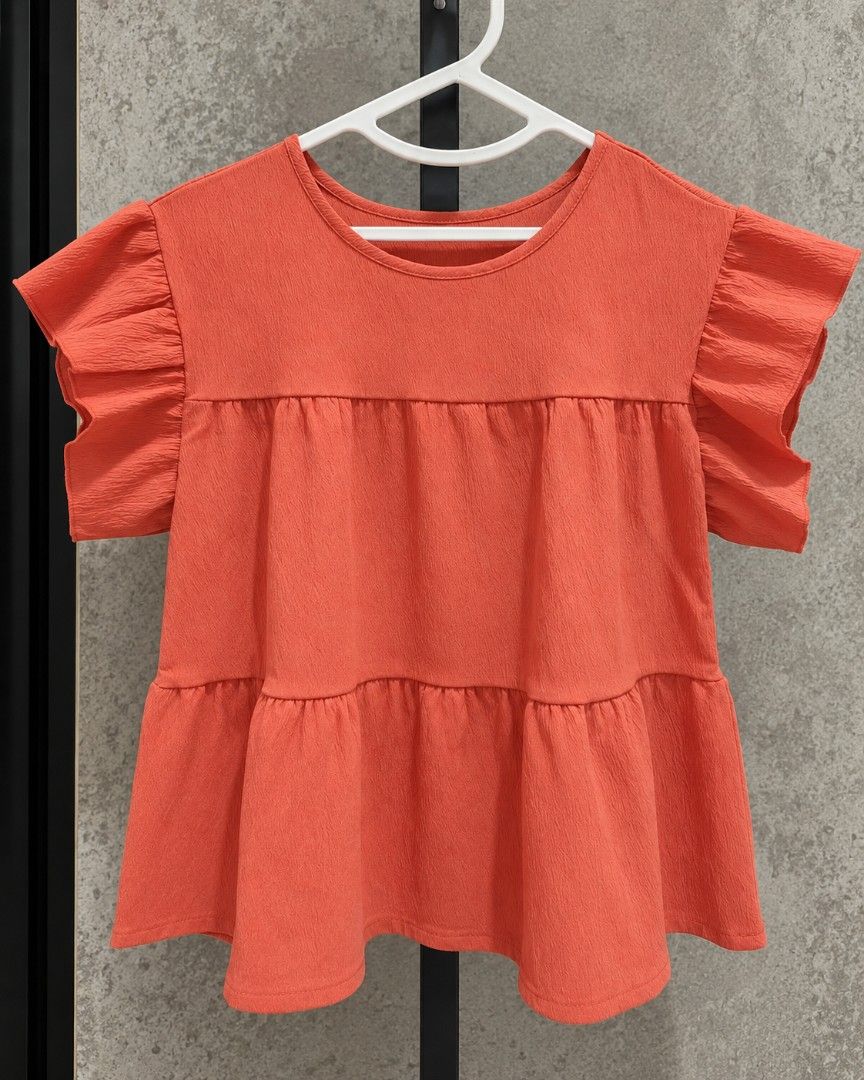 Orange Tiered Ruffle Sleeve Top (Category: Blouses) located in Taguig. Submitted by roniquefinds (Listing ID 1463941799, Image 1). Description: .
