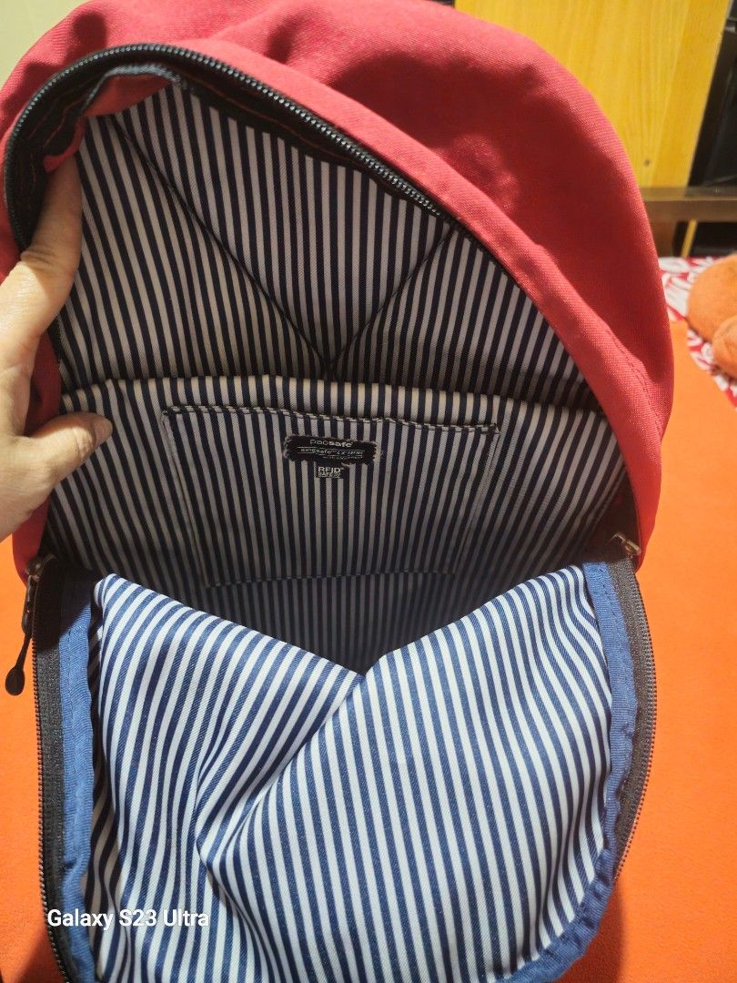 Pacsafe Slingsafe LX 300 Backpack (Category: Backpacks) located in Quezon City. Submitted by bagsforless16 (Listing ID 1463982767, Image 3). Description: Pacsafe Slingsafe LX 300 Backpack Color: Red Durable Material Stylish Design Perfect for Everyday Use Padded Laptop Slot Top Hook Clean Ready to Use Size: 15" x 13" x 6" .