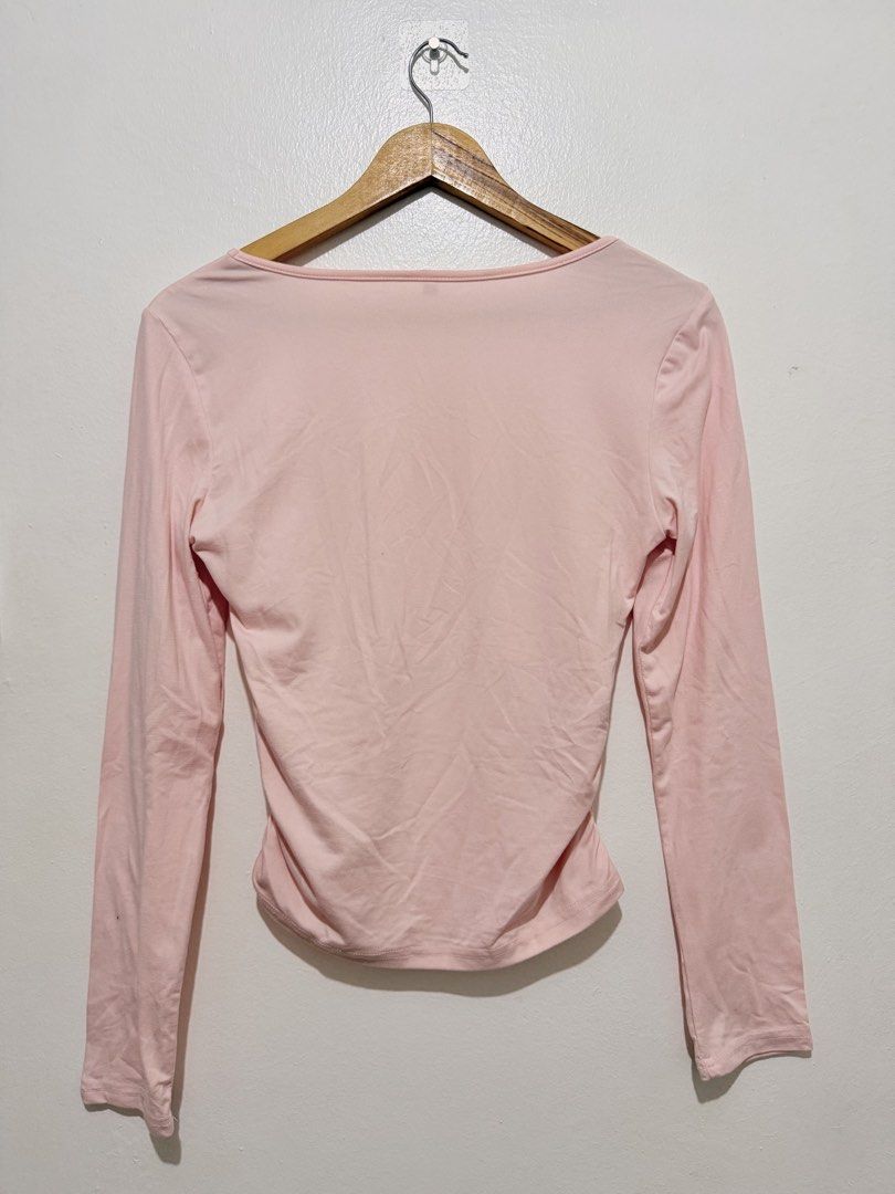 Pastel Pink Square Neck Long Sleeve Top (Category: Longsleeves) located in Caloocan City. Submitted by ashpreloves (Listing ID 1464083611, Image 2). Description: - Cute pink long-sleeved top - Flattering square neckline - Side ruched detailing - Soft and stretchy fabric - Versatile for casual or dressed-up outfits - Easy to pair with jeans or skirts.