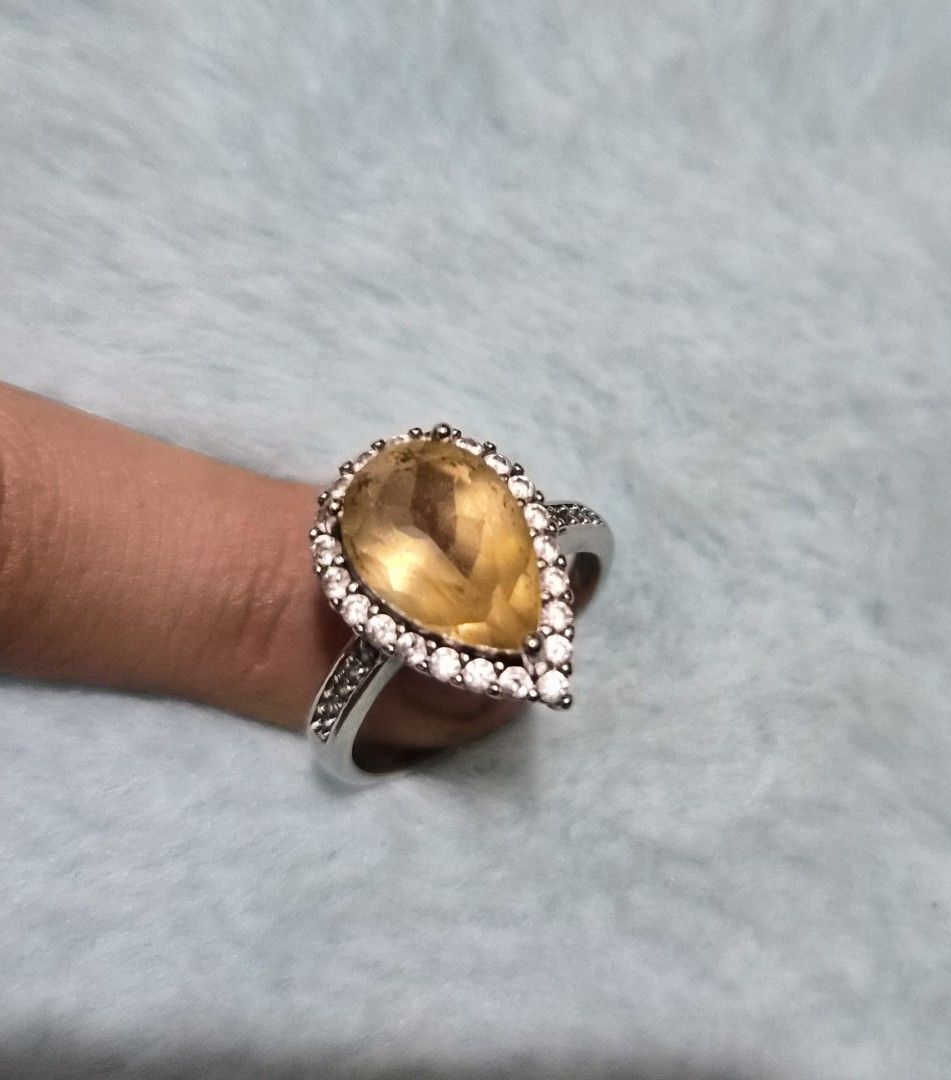 Pear Cut Citrine Ring with Diamond Halo (Category: Rings) located in Mandaue City. Submitted by chuchi152615 (Listing ID 1462852239, Image 2). Description: - Elegant pear-cut citrine center stone - Surrounded by a sparkling diamond halo - Diamond accents on the band for extra brilliance - Believed to attract abundance, joy, and success - A perfect statement ring for any occasion.