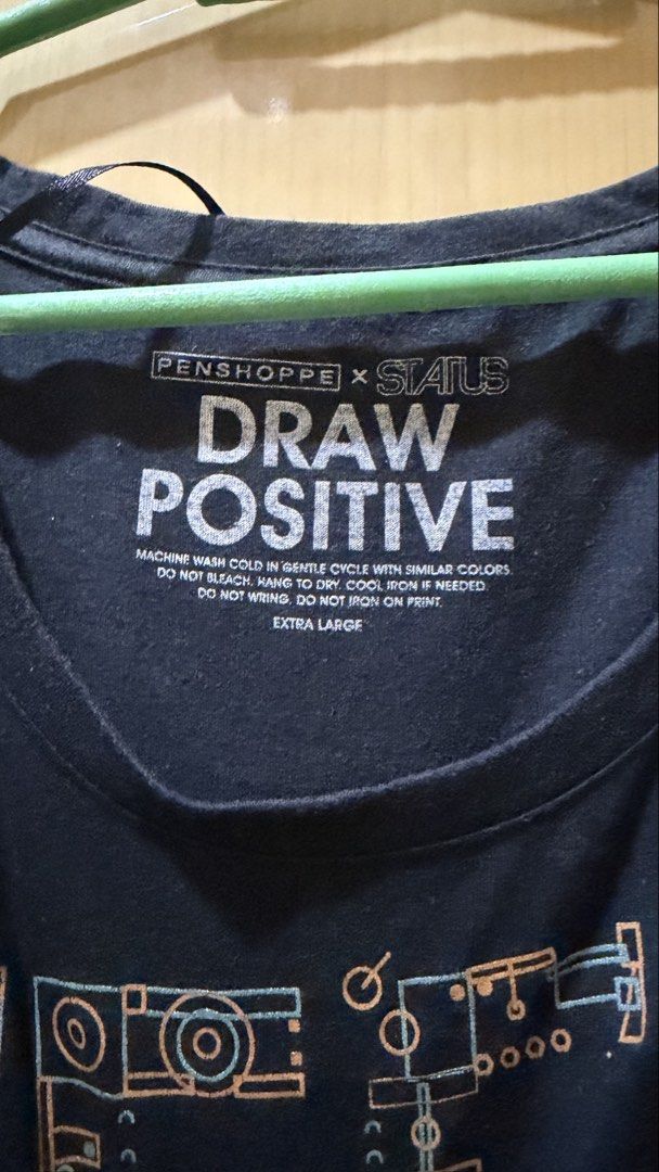 Penshoppe x Status Draw Positive Graphic Tee Extra Large (Category: Shirts) located in Manila. Submitted by nayeoniescart (Listing ID 1464103496, Image 2). Description: PRE LOVED Penshoppe x Status MOP: gcash / MOD: jnt - Color: Black - Size: Extra Large (XL) - Design: Features 'Draw Positive' slogan with a cool mechanical graphic - Style: Casual, easy to pair with jeans or shorts.
