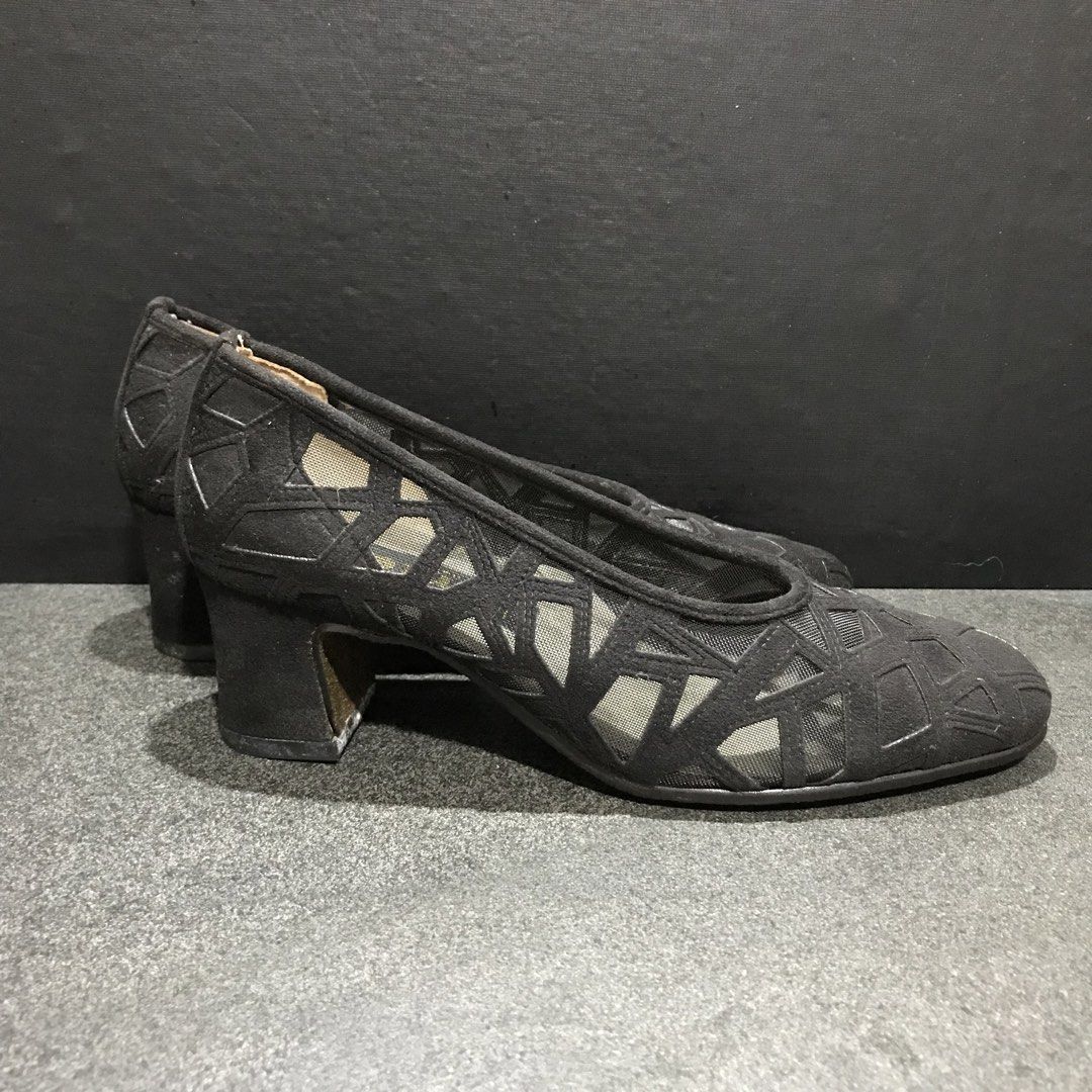 PERTE Black Mesh Cut-out Block Heels (Category: Heels) located in Baao. Submitted by all.things.japan (Listing ID 1463993011, Image 3). Description: - Brand: PERTE - Color: Black - Design: Mesh cut-out with geometric pattern - Heel Type: Comfortable block heel - Style: Versatile, perfect for dressing up or down - Condition: Good.