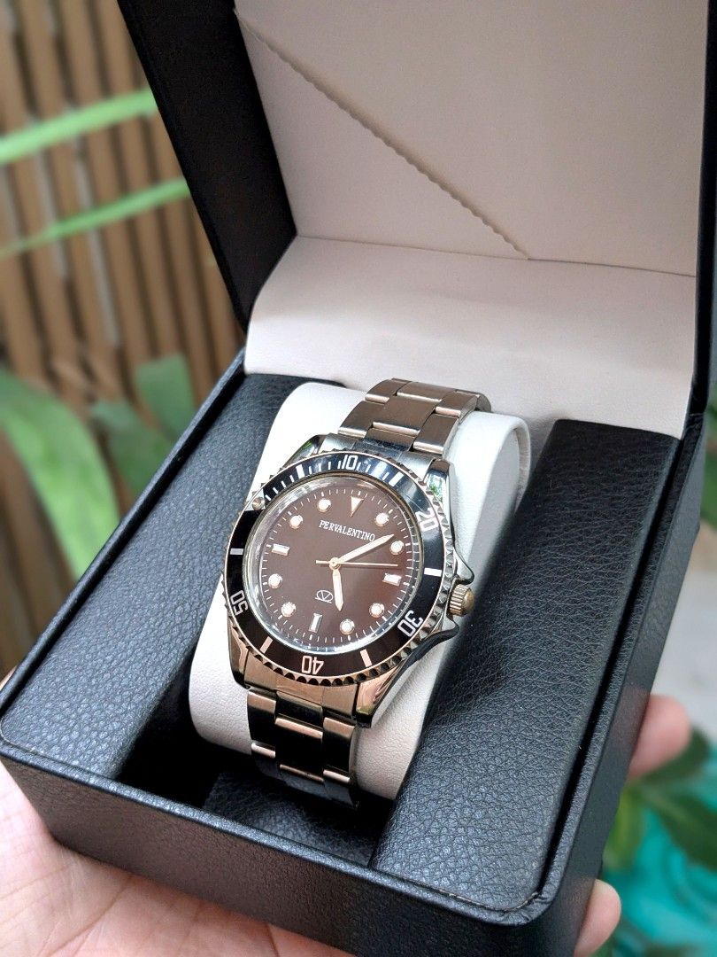 PerValentino Divers Rotating Bezel Men's Watch (Category: Men's Watches) located in Quezon City. Submitted by nnncorner (Listing ID 1464055738, Image 3). Description: PerValentino Divers Rotating Bezel Men's Watch 100% Original 100% Working Condition Japan Quartz Movement Black Dial & Rotating Bezel Water Resistant Bigger than 20 pesos coin size dial Fits 16-22 cm wrist (adjustable) Rhodium Plated Body (High resistant to rust & tarnishing) Strap 