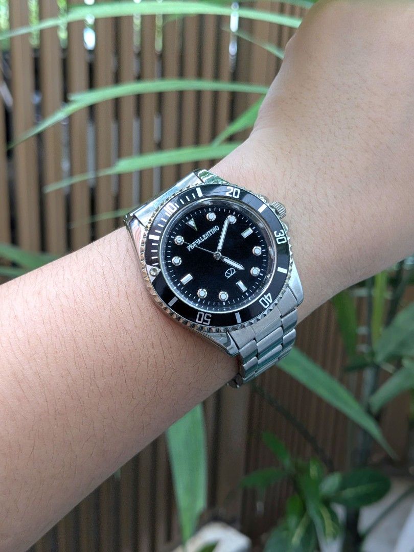 PerValentino Divers Rotating Bezel Men's Watch (Category: Men's Watches) located in Quezon City. Submitted by nnncorner (Listing ID 1464055738, Image 2). Description: PerValentino Divers Rotating Bezel Men's Watch 100% Original 100% Working Condition Japan Quartz Movement Black Dial & Rotating Bezel Water Resistant Bigger than 20 pesos coin size dial Fits 16-22 cm wrist (adjustable) Rhodium Plated Body (High resistant to rust & tarnishing) Strap 