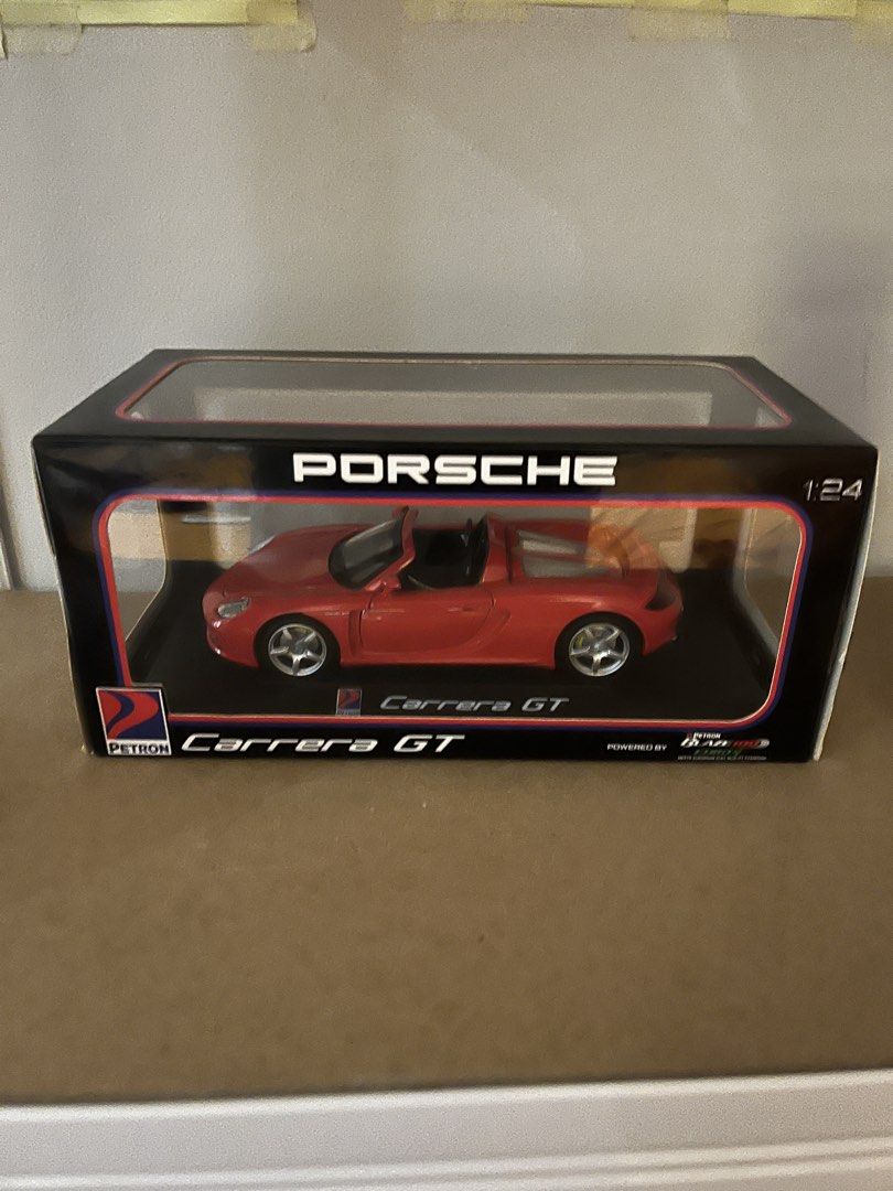 PETRON Porsche Carrera GT (Category: Vehicle & Diecast Models) located in Manila. Submitted by omo__ (Listing ID 1464065574, Image 1). Description: - 1:24 scale - Box opened.