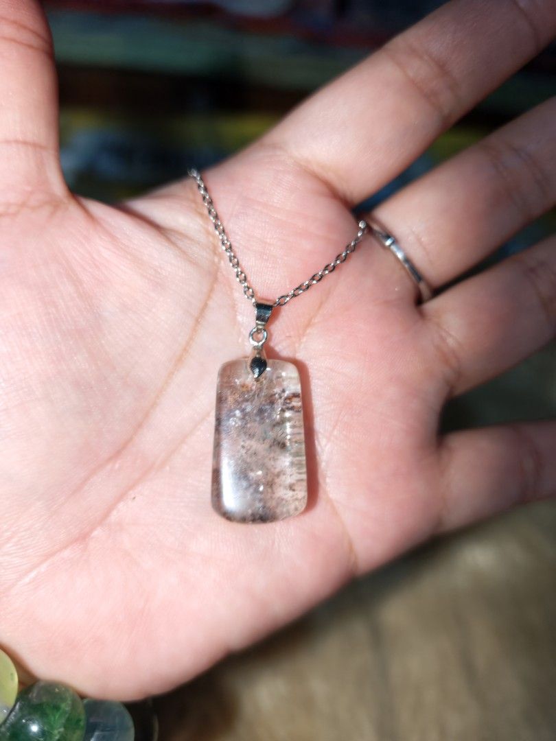 Phantom Quartz Pendant (Category: Necklaces) located in Quezon City. Submitted by piaoliangcollections.ph (Listing ID 1463953686, Image 3). Description: Phantom quartz is a unique crystal believed to promote spiritual growth, personal transformation, and the release of past emotional blockages. Spiritual and Emotional Benefits Personal Transformation: Symbolizes the journey of evolution, helping you move past stagnation and embrace major life tra