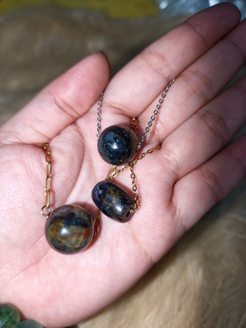 Pietersite Pendants Natural Crystal (Category: Necklaces) located in Quezon City. Submitted by piaoliangcollections.ph (Listing ID 1463950279, Image 1). Description: price is per piece. Natural Pietersite Crystal. Pietersite is known as the "Tempest Stone" because its swirling, storm-like patterns of gold, blue, bronze, and gray resemble a turbulent storm. Core Meanings & Metaphysical Properties Transformation & Change: Pietersite is viewed as a 