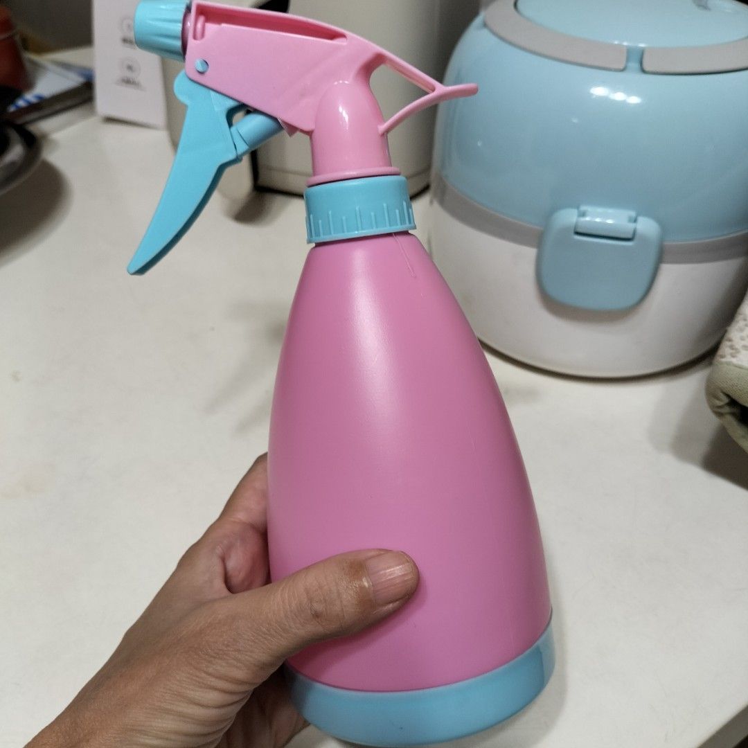 Pink and Blue Trigger Spray Bottle for Cleaning or Plants (Category: Cleaning Tools & Supplies) located in Paranaque City. Submitted by decluttering-all (Listing ID 1463980531, Image 2). Description: - Cute pink spray bottle with blue trigger and nozzle. - Ideal for household cleaning solutions or misting plants. - Ergonomic design for a comfortable grip. - Made from durable plastic. - Ready for your cleaning or gardening needs. p35 only recently