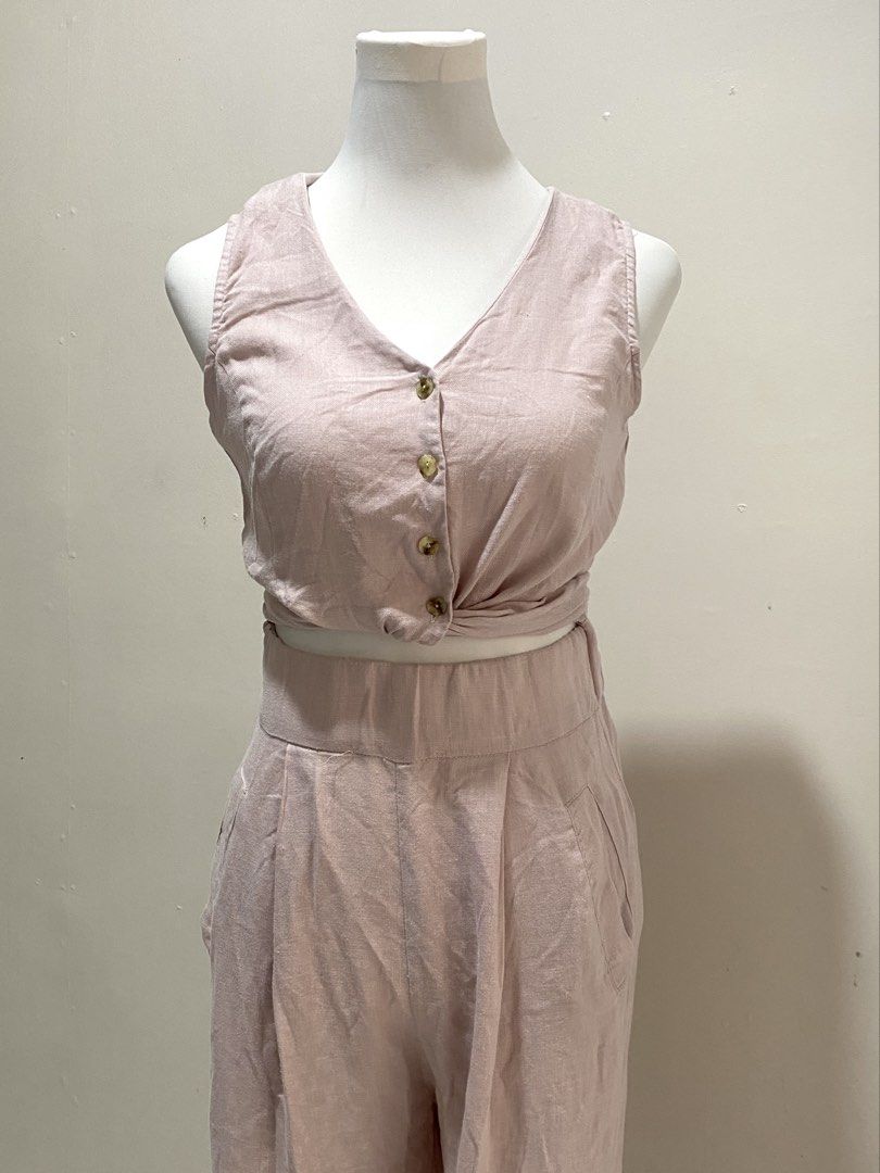 Pink Linen jumper (Category: Sets or Coordinates) located in Manila. Submitted by toastybread (Listing ID 1464023443, Image 1). Description: - Adorable pink linen blend set - Sleeveless crop top with button front and tie waist - High-waisted pants with convenient pockets - Comfortable and stylish for any occasion - Versatile for casual outings or dressing up.