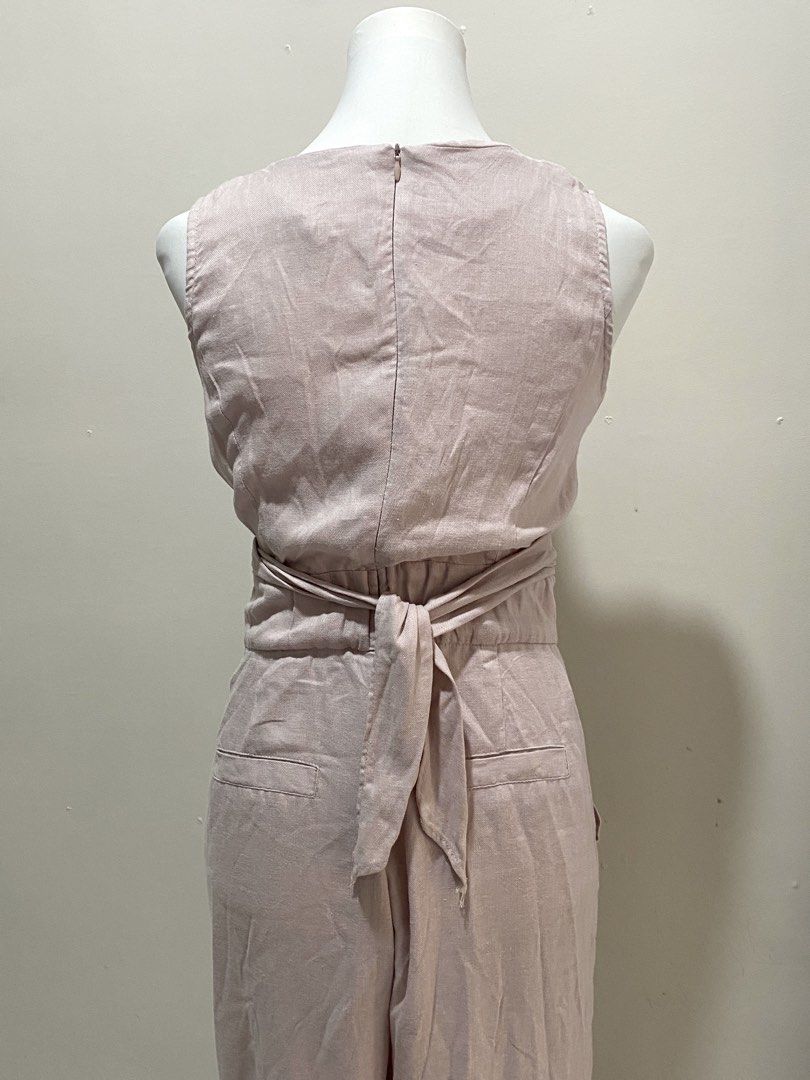 Pink Linen jumper (Category: Sets or Coordinates) located in Manila. Submitted by toastybread (Listing ID 1464023443, Image 2). Description: - Adorable pink linen blend set - Sleeveless crop top with button front and tie waist - High-waisted pants with convenient pockets - Comfortable and stylish for any occasion - Versatile for casual outings or dressing up.