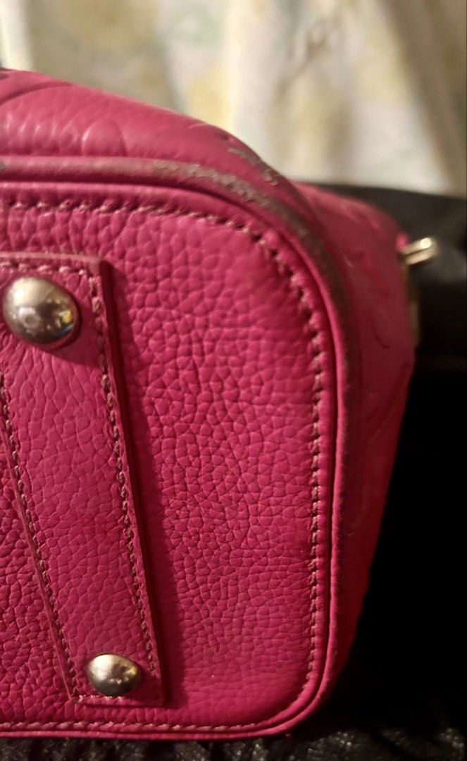 Pink Monogram standalone bag with lock and key (Category: Purses & Pouches) located in Quezon City. Submitted by asiaco (Listing ID 1464023586, Image 2). Description: Pink monogram handbag. Textured leather, embossed pattern. Zipper closure, interior zip pocket. Minor wear on corners/edges. Great for daily use.comes with lock and key for protection. .
