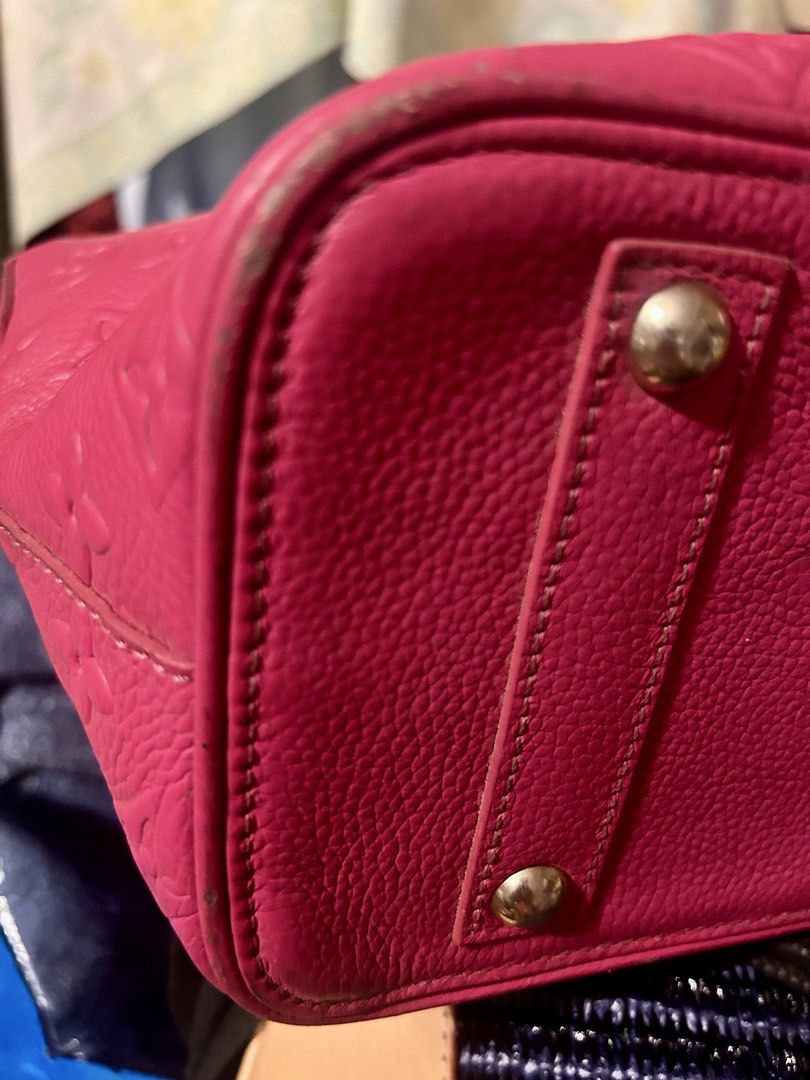 Pink Monogram standalone bag with lock and key (Category: Purses & Pouches) located in Quezon City. Submitted by asiaco (Listing ID 1464023586, Image 3). Description: Pink monogram handbag. Textured leather, embossed pattern. Zipper closure, interior zip pocket. Minor wear on corners/edges. Great for daily use.comes with lock and key for protection. .