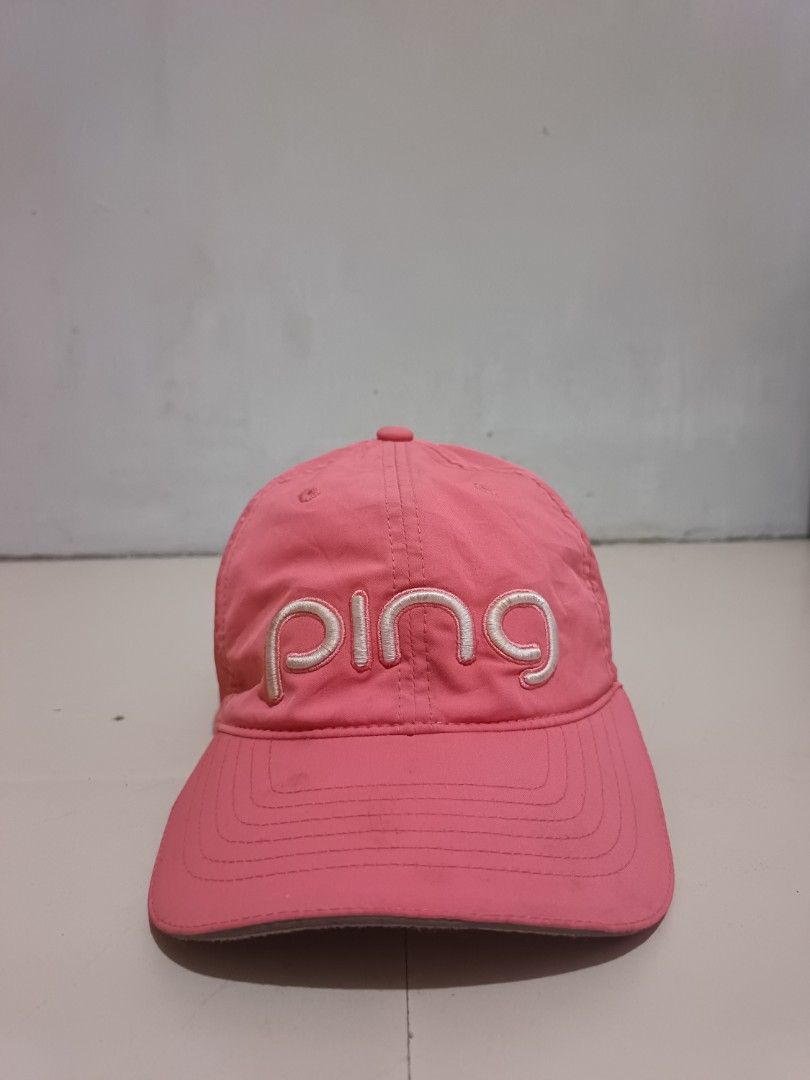 Pink Ping Golf Cap (Category: Caps & Hats) located in Manila. Submitted by unplnndco. (Listing ID 1464046648, Image 1). Description: - Pink Ping cap -Condition: 9/10 -Colorate: 9/10 -Issue: shown on last 2 picture - Embroidered Ping logo on front and back - Perforated sides for breathability - Adjustable strap for a custom fit - Made with 87% Polyester and 13% Spandex - Ideal for golf or everyday casual wear.