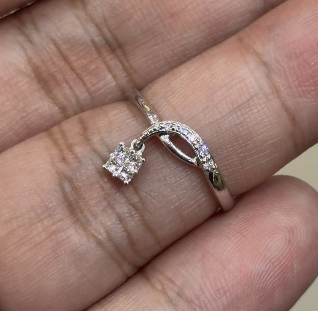 Platinum Dangle Diamond Ring (Category: Rings) located in Las Pinas. Submitted by houseofgems0 (Listing ID 1464078187, Image 1). Description: Platinum Dangle Diamond Ring Details: - PT900 | 2.6 grams - Size: 6 - 5 round and 4 princess-cut natural diamonds - Total Carat Weight: .15ct stamped - PRICE: ₱21,000 💎 All items are 100% AUTHENTIC/PAWNABLE. 💎 LAYAWAY AVAILABLE 4 months no interest. Send us a message to inquire..