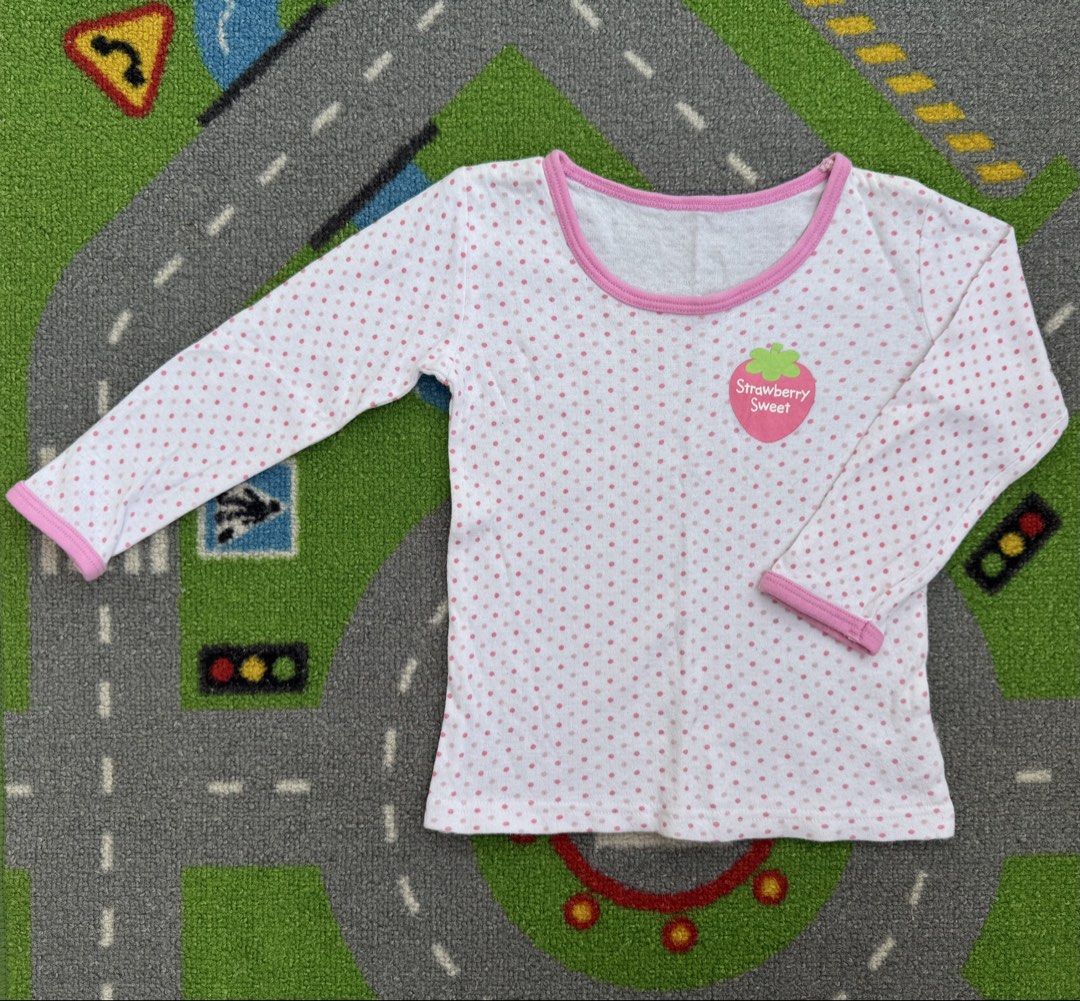 Polka Dot Long Sleeve Shirt (Category: Babies & Kids Fashion) located in Rizal. Submitted by preloovved (Listing ID 1463946702, Image 1). Description: - Preloved, 2yo - White long-sleeved shirt - Adorable pink polka dot pattern - Features a cute 'Strawberry Sweet' strawberry graphic - Pink trim on neckline and cuffs - Made from soft and comfortable material - Perfect for casual, everyday wear Meet-up only in GB1 San Mateo, Rizal Shipping fee c/o 