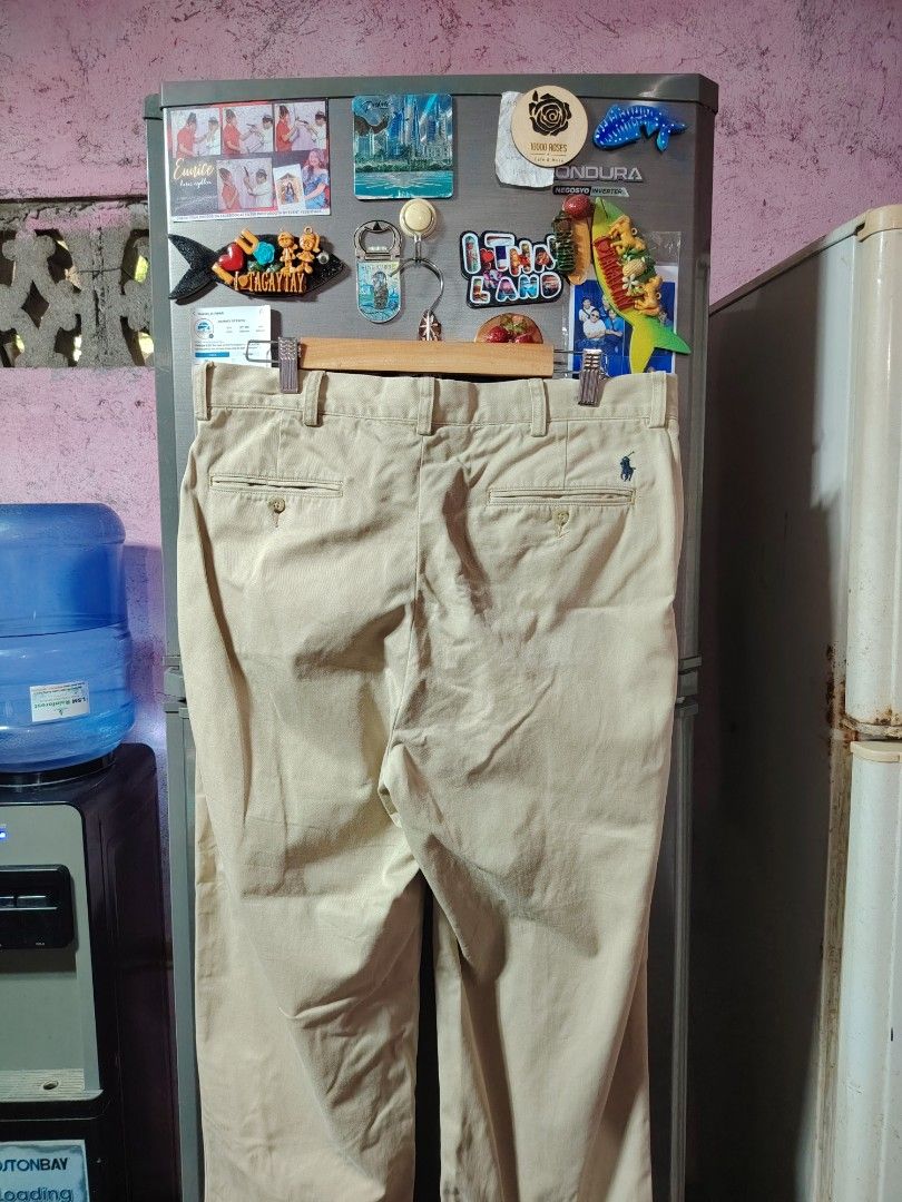 Polo Ralph Lauren Reverse Pleated Pants (Category: Trousers) located in General Santos City (Dadiangas). Submitted by rafaelmir09800 (Listing ID 1463965140, Image 2). Description: - Polo Ralph Lauren Khaki Pants - Size 34 on tag (34/32) - Style: Reverse Pleated Prospect Pant - Material: 100% Cotton - Fit: Classic Fit - Closure: Button at waist - Pockets: Two back pockets, one with button closure - Detail: Embroidered iconic Polo player logo on ba