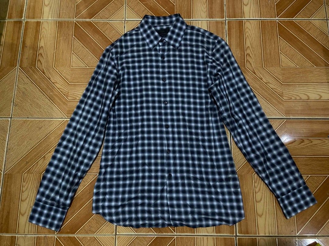 PRADA Blue/Navy/White Check Button-Down Longsleeve Size 41/16 (Category: Coats, Jackets and Outerwear) located in Paranaque City. Submitted by jnthn.c (Listing ID 1464052841, Image 1). Description: PRADA Blue/Navy/White Plaid Button-Down Longsleeve Size 41/16 on Tag Actual Size: 30 x 19 fits on Large to XL Issue: Nagdikit yung Tag need iFlashlight para mabasa, Need wash & Need plantsa.