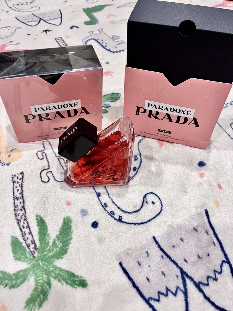 Prada Paradoxe Intense Eau de Parfum (Category: Fragrance & Deodorants) located in Tabuk. Submitted by twotimestooo (Listing ID 1464059923, Image 3). Description: - Prada Paradoxe Intense Eau de Parfum - Refillable spray bottle - Comes with two boxes: one opened (perfume bottle removed), one sealed - Ideal fragrance for everyday wear.