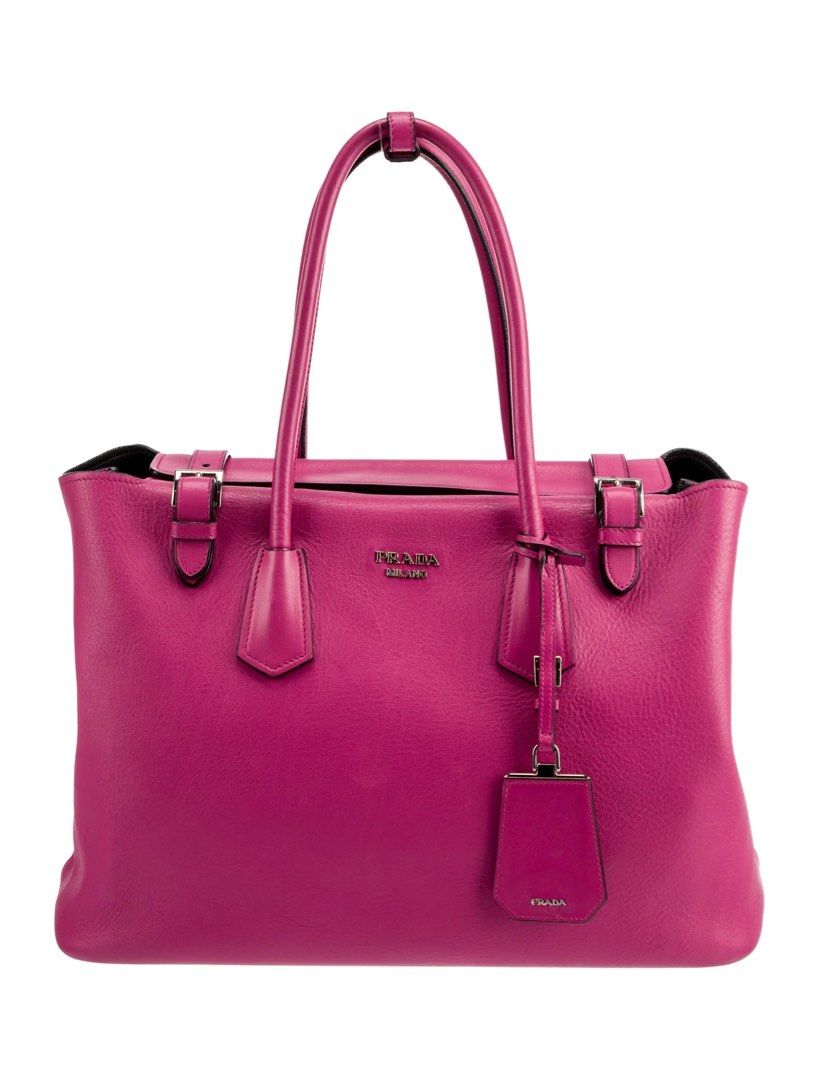 Prada Saffiano Tote Bag Pink (Category: Luxury Bags & Wallets) located in Cauayan City . Submitted by espiritucj (Listing ID 1464082172, Image 1). Description: Thrifted - - Prada tote bag - Vibrant pink Saffiano leather - Iconic Prada logo on front - Interior: zip pocket and central compartment - Gold-tone hardware - Comes with Prada inner pouch - Ideal for everyday use or travel.