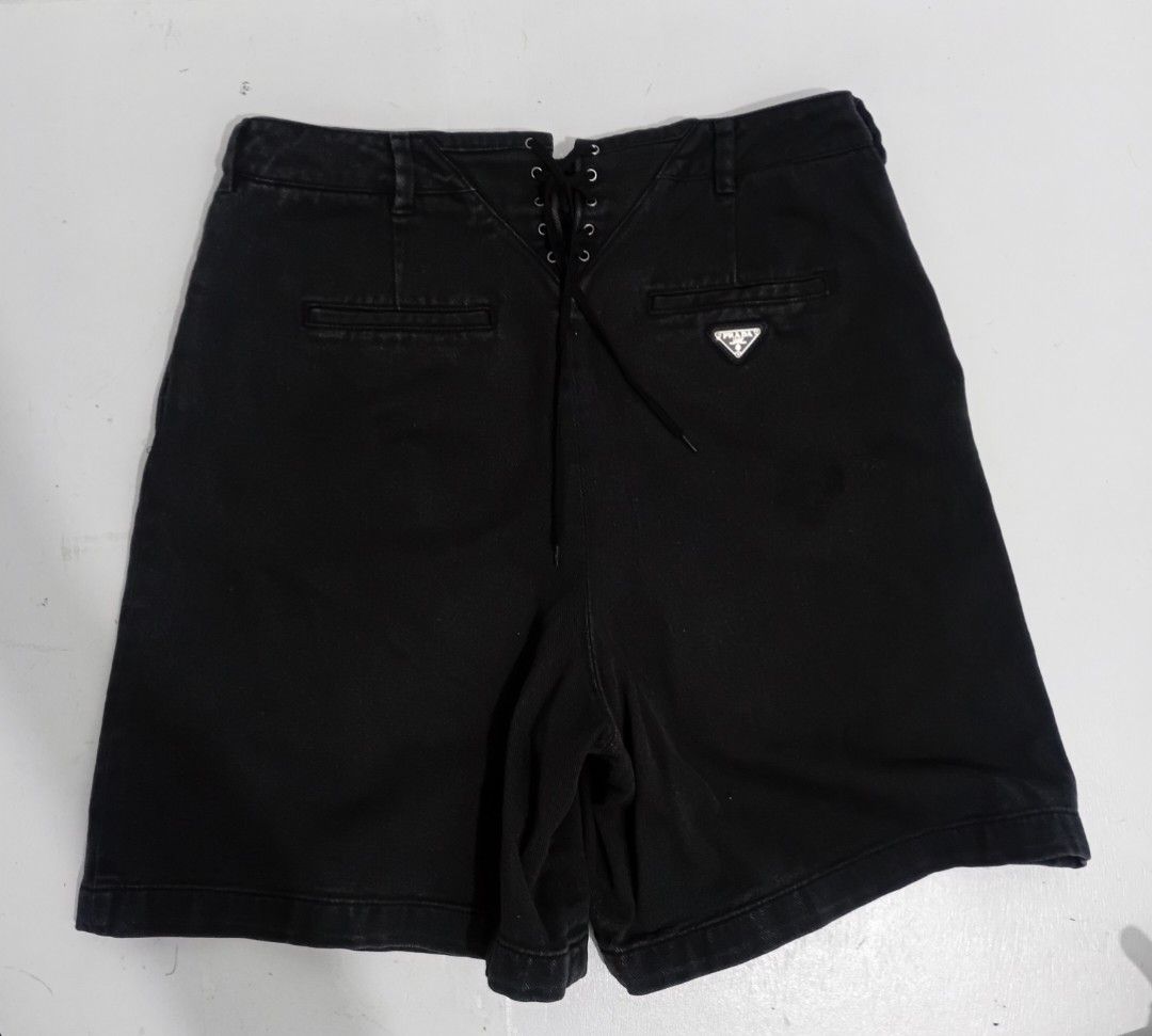 Prada Lace-Up Denim JORTS (Category: Luxury Apparel) located in Navotas City. Submitted by ms.soulana (Listing ID 1463952623, Image 3). Description: - Authentic Prada black denim Jorts -Hi Waist -Black - Size 40 W26-32 X L 20 - Unique lace-up detail on front and back - Iconic Prada triangle logo on back pocket -Riri Zip Good Condition 9/10 .