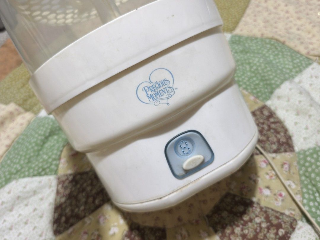 Precious Moments Bottle Sterilizer Steamer (Category: Breastfeeding & Bottle Feeding) located in Taguig. Submitted by juliestjuly (Listing ID 1464054754, Image 3). Description: - Precious Moments Bottle Sterilizer - Steams bottles clean for hygiene - Easy to use with a built-in timer - Top rack lifts off for easy access - Works well to keep baby bottles hygienic.
