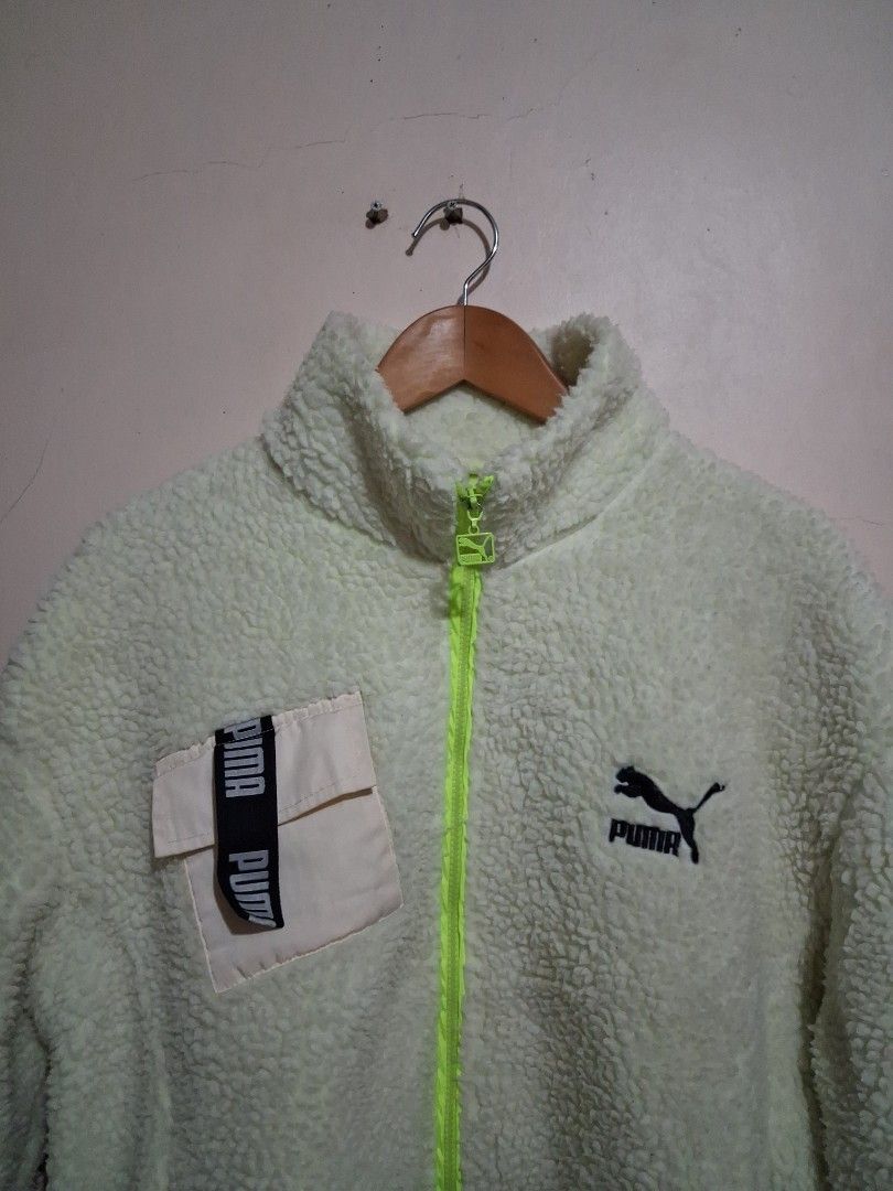 Puma Fleece Jacket - Light Yellow (Category: Coats, Jackets and Outerwear) located in Manila. Submitted by randf_selections (Listing ID 1464125221, Image 2). Description: Super cozy Puma fleece jacket. Light yellow color with a neon green zipper. Has a small chest pocket with Puma branding. Great for layering or wearing on its own. Soft and warm material..