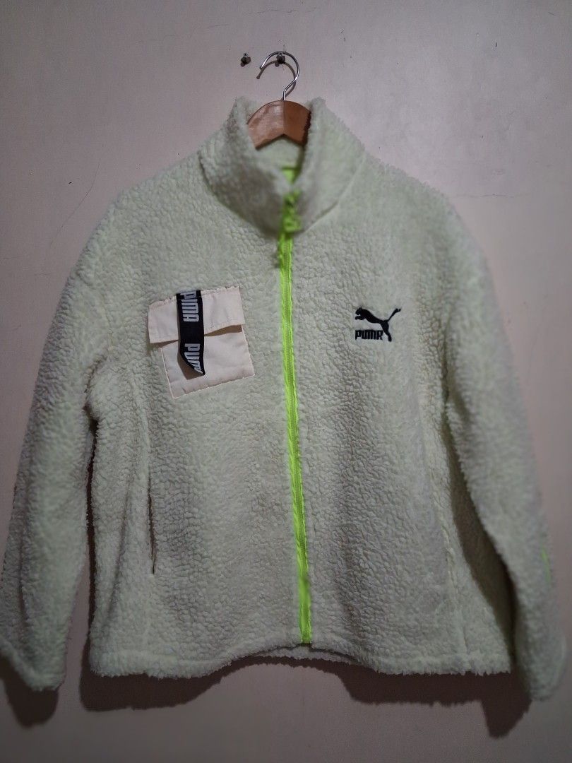 Puma Fleece Jacket - Light Yellow (Category: Coats, Jackets and Outerwear) located in Manila. Submitted by randf_selections (Listing ID 1464125221, Image 1). Description: Super cozy Puma fleece jacket. Light yellow color with a neon green zipper. Has a small chest pocket with Puma branding. Great for layering or wearing on its own. Soft and warm material..