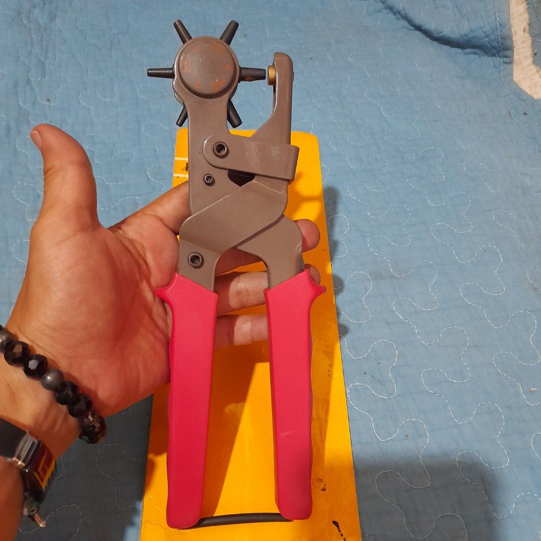 Punch Plier Tool with Multiple Hole Sizes (Category: Construction Tools & Equipment) located in Bocaue. Submitted by marajapansurplus (Listing ID 1463970266, Image 3). Description: - Punch plier tool with rotating head - Multiple hole sizes available - Features red, non-slip handles - looks new in original packaging - Ideal for crafts and leatherwork - Simple and easy to operate.