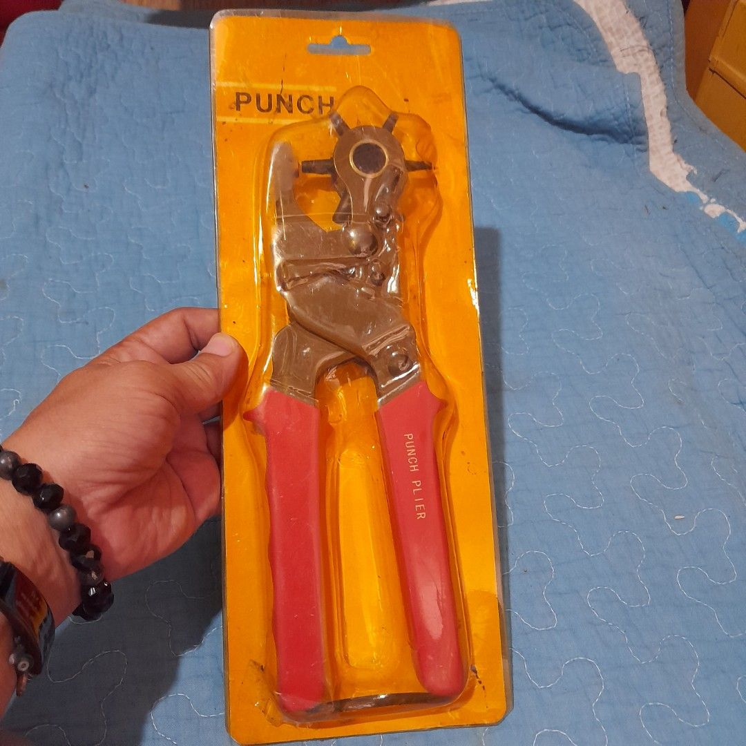 Punch Plier Tool with Multiple Hole Sizes (Category: Construction Tools & Equipment) located in Bocaue. Submitted by marajapansurplus (Listing ID 1463970266, Image 2). Description: - Punch plier tool with rotating head - Multiple hole sizes available - Features red, non-slip handles - looks new in original packaging - Ideal for crafts and leatherwork - Simple and easy to operate.