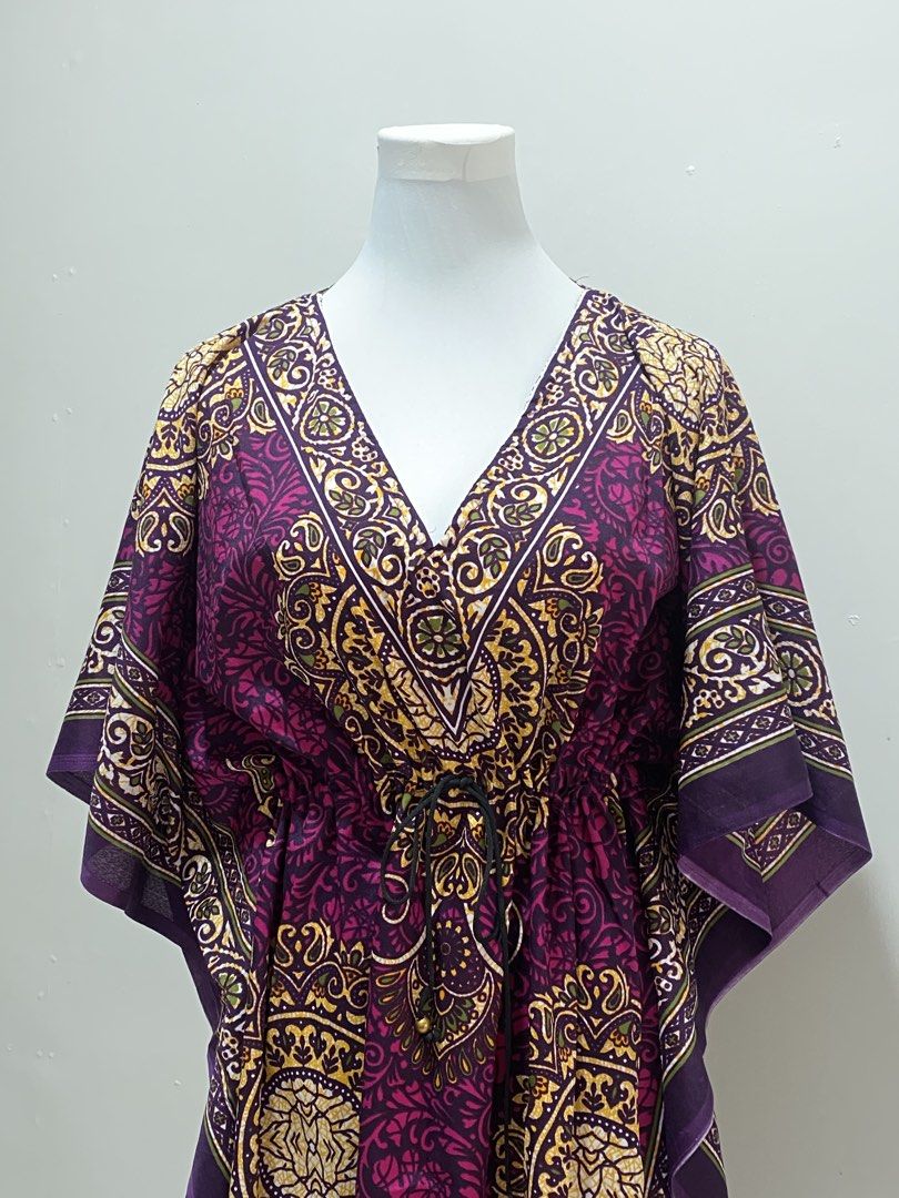 Purple Bohemian dress (Category: Dresses) located in Manila. Submitted by toastybread (Listing ID 1464022314, Image 3). Description: - Vibrant purple bohemian print V-neck kaftan dress - Features a drawstring waist with a black buckle detail - Comfortable flowing sleeves and relaxed silhouette - Versatile for beach cover-up or casual wear - Unique all-over pattern.