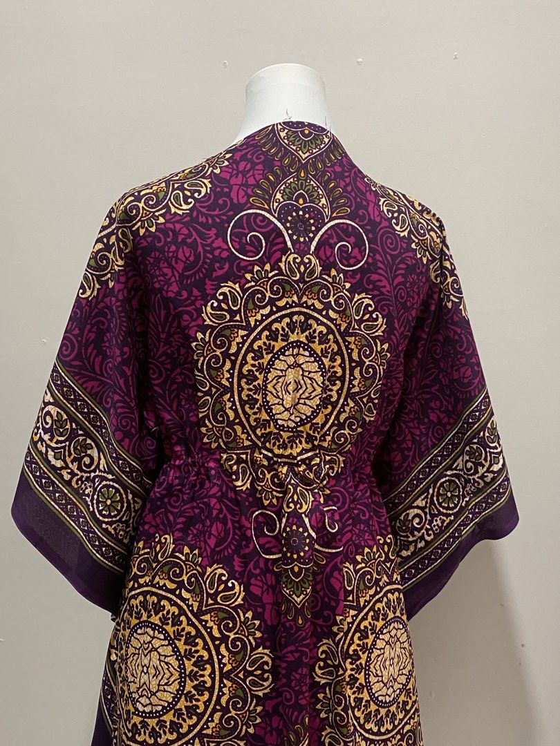 Purple Bohemian dress (Category: Dresses) located in Manila. Submitted by toastybread (Listing ID 1464022314, Image 2). Description: - Vibrant purple bohemian print V-neck kaftan dress - Features a drawstring waist with a black buckle detail - Comfortable flowing sleeves and relaxed silhouette - Versatile for beach cover-up or casual wear - Unique all-over pattern.
