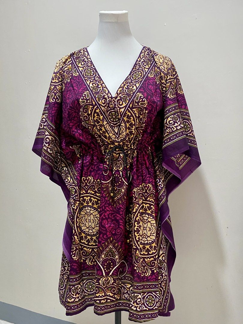 Purple Bohemian dress (Category: Dresses) located in Manila. Submitted by toastybread (Listing ID 1464022314, Image 1). Description: - Vibrant purple bohemian print V-neck kaftan dress - Features a drawstring waist with a black buckle detail - Comfortable flowing sleeves and relaxed silhouette - Versatile for beach cover-up or casual wear - Unique all-over pattern.