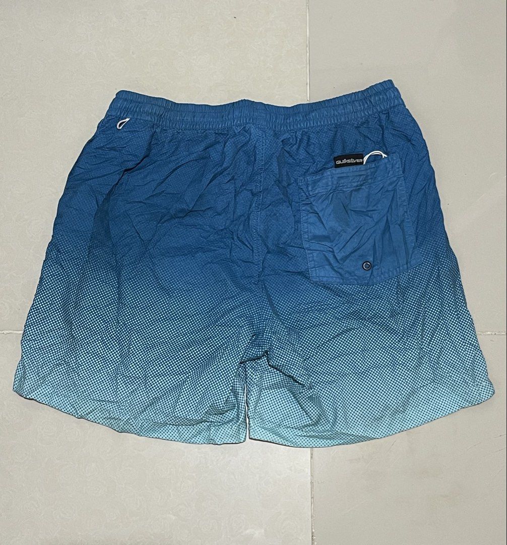 Quiksilver Blue Gradient Swim Shorts Size Medium (Category: Swim Trunks & Board Shorts) located in Manila. Submitted by micoletszx81430 (Listing ID 1464073224, Image 3). Description: - Quiksilver Swim Shorts - Size: Medium - Color: Blue Gradient - Waistline: 28-33 inches - Length: 15.5 inches - Features: Drawstring, Back Pocket - Material: Polyester & Elastane - Ideal for: Beach or Pool.