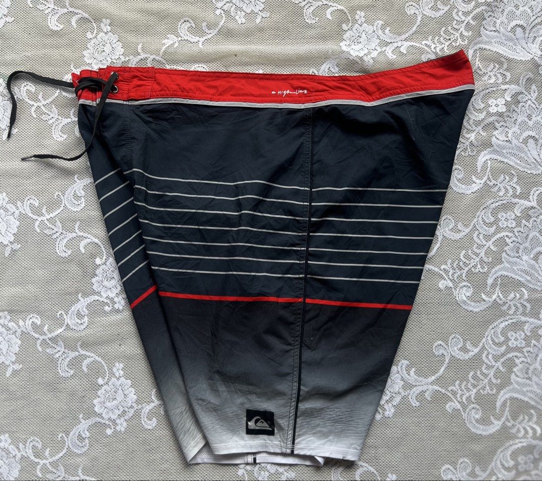 Quiksilver Board Shorts Size 40 (Category: Swim Trunks & Board Shorts) located in Manila. Submitted by trustedmichael. (Listing ID 1464077203, Image 3). Description: Quick silver W 40-44 L 22 Size 40 on tag ✅Can do Vc for item checking/ Assurance - Brand: Quiksilver - Color: Black with red and white stripes - Size: 40 - Features: Zip pocket on back, drawstring waist - Branding: Quiksilver logo on front and back - Ideal for: Swimming, surfing.