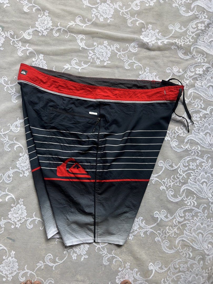 Quiksilver Board Shorts Size 40 (Category: Swim Trunks & Board Shorts) located in Manila. Submitted by trustedmichael. (Listing ID 1464077203, Image 2). Description: Quick silver W 40-44 L 22 Size 40 on tag ✅Can do Vc for item checking/ Assurance - Brand: Quiksilver - Color: Black with red and white stripes - Size: 40 - Features: Zip pocket on back, drawstring waist - Branding: Quiksilver logo on front and back - Ideal for: Swimming, surfing.