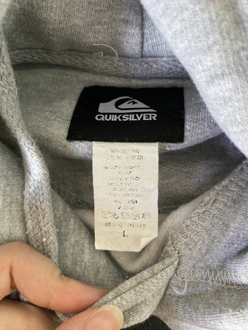 Quiksilver Grey Hoodie Size L (Category: Hoodies) located in Caloocan City. Submitted by cherub3ar (Listing ID 1463956734, Image 2). Description: - Classic grey Quiksilver hoodie - Features iconic front logo - Convenient kangaroo pocket - Adjustable hood with drawstrings - Ideal for comfortable and stylish casual outfits W: 24” L: 29” Sleeve length: 23”.