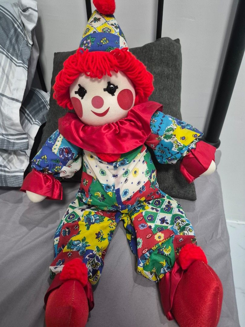 Quilted Patchwork Clown Doll Rag Doll 19inches (Category: Plushies & Soft Toys) located in Tarlac. Submitted by mandiryune (Listing ID 1464010382, Image 1). Description: - Adorable patchwork clown doll - Features colorful fabric with a quilted pattern - Fun red yarn hair and big red shoes - Whimsical and eye-catching design - Ideal for decoration or as a toy - Approximately 20 inches standing.