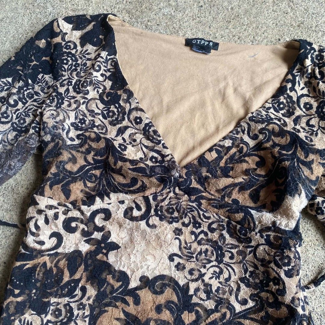 Vintage Whimsygoth top ✨ (Category: Longsleeves) located in Davao. Submitted by calli_2219 (Listing ID 1463967992, Image 2). Description: - Chic brown and black floral print top - Long sleeves with stylish flared cuffs - Flattering V-neckline with adjustable tie waist - Elegant sheer overlay with a comfortable solid lining - Unique all-over pattern - Perfect for a night out or a casual day look Hearing offers for now ✨ Message me your offers 🫶🏻