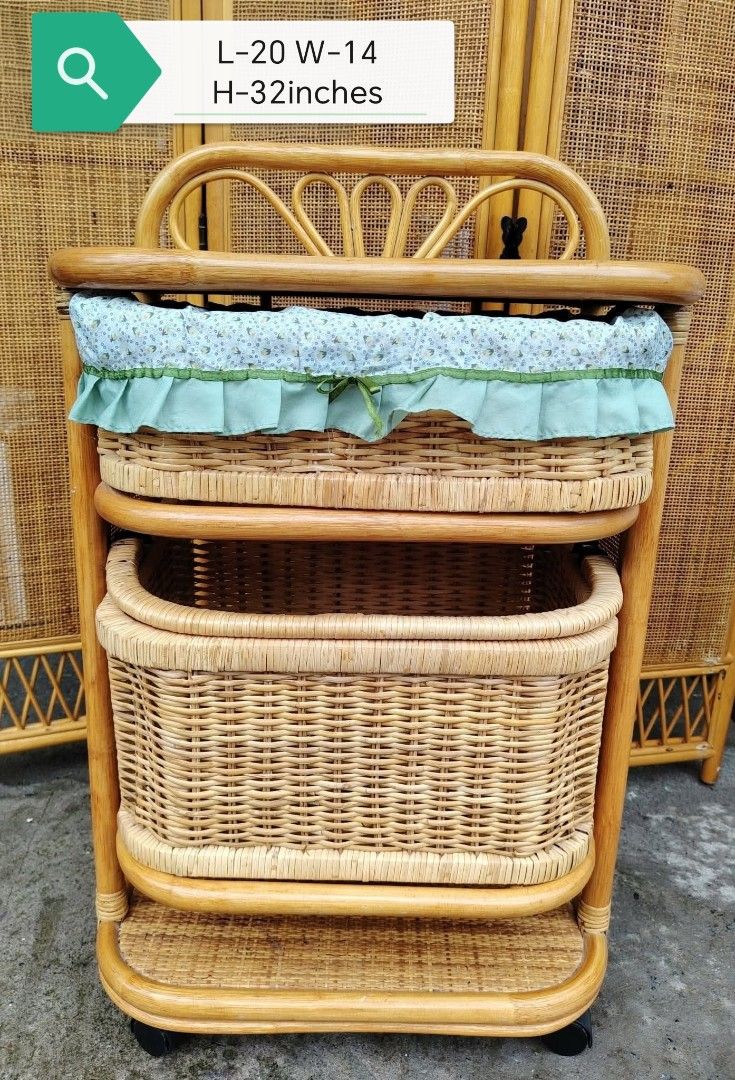 Rattan Laundry Basket (Category: Bathroom & Kitchen Fixtures) located in Taguig. Submitted by sydney08.owl (Listing ID 1463993749, Image 1). Description: Storage Organizer Cart with Fabric Basket, with wheels. 📏 Size: L-20" × W-14" × H-32" ✨ Beautiful vintage-style rattan design 🧺 2 spacious baskets + lower shelf 🛞 With wheels — easy to move around 💸 Php3500 negotiable 💚 Perfect for bedroom, bathroom, nursery, or living room storage.