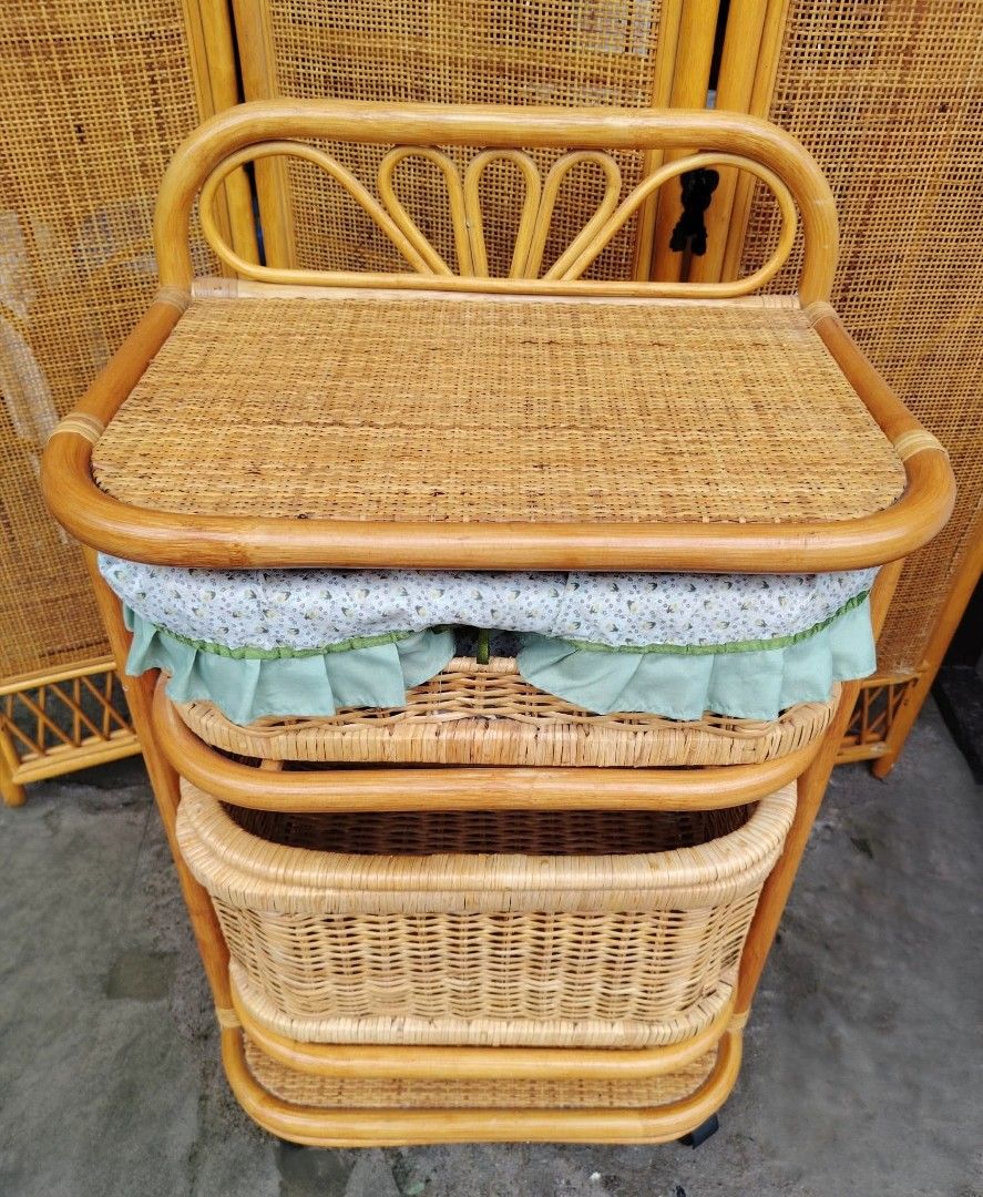 Rattan Laundry Basket (Category: Bathroom & Kitchen Fixtures) located in Taguig. Submitted by sydney08.owl (Listing ID 1463993749, Image 2). Description: Storage Organizer Cart with Fabric Basket, with wheels. 📏 Size: L-20" × W-14" × H-32" ✨ Beautiful vintage-style rattan design 🧺 2 spacious baskets + lower shelf 🛞 With wheels — easy to move around 💸 Php3500 negotiable 💚 Perfect for bedroom, bathroom, nursery, or living room storage.