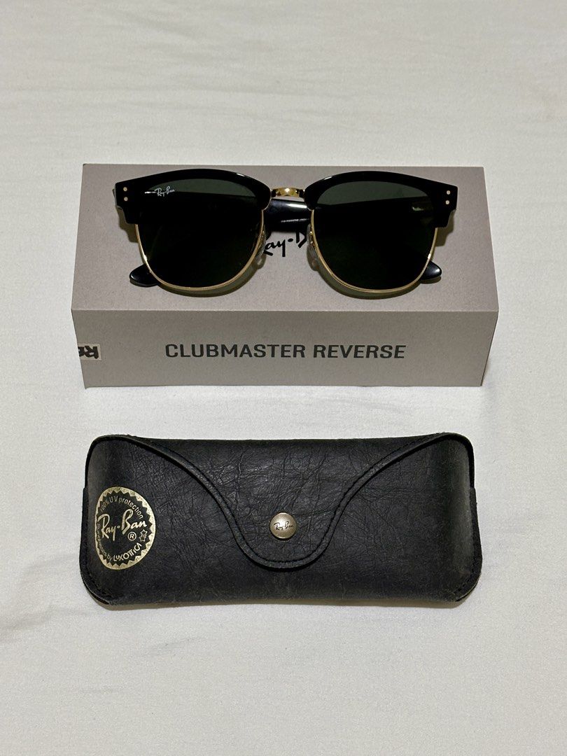 Ray-Ban Clubmaster Reverse Sunglasses (Category: Sunglasses & Eyewear) located in General Trias. Submitted by milcoxx (Listing ID 1464070810, Image 1). Description: - Authentic Ray-Ban Clubmaster Reverse Sunglasses - Color: Black frame with gold accents - Includes original box and case - Model: RB0504S 6077/VR 54 21 145 3N - Ideal for everyday wear Preloved. Maalaga sa gamit. SRP P15,990 RFS: need cash.